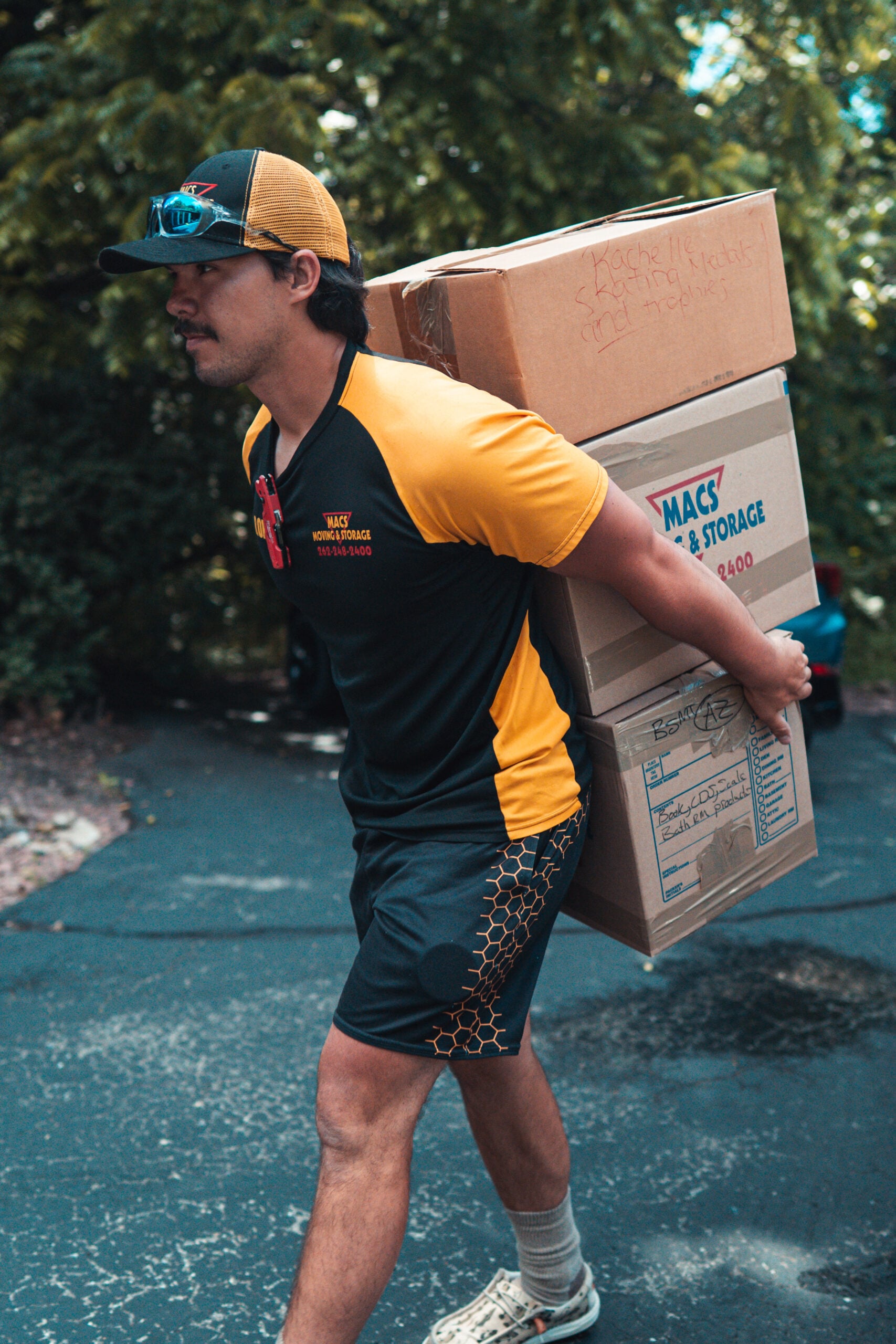 macs long distance movers carrying boxes residential