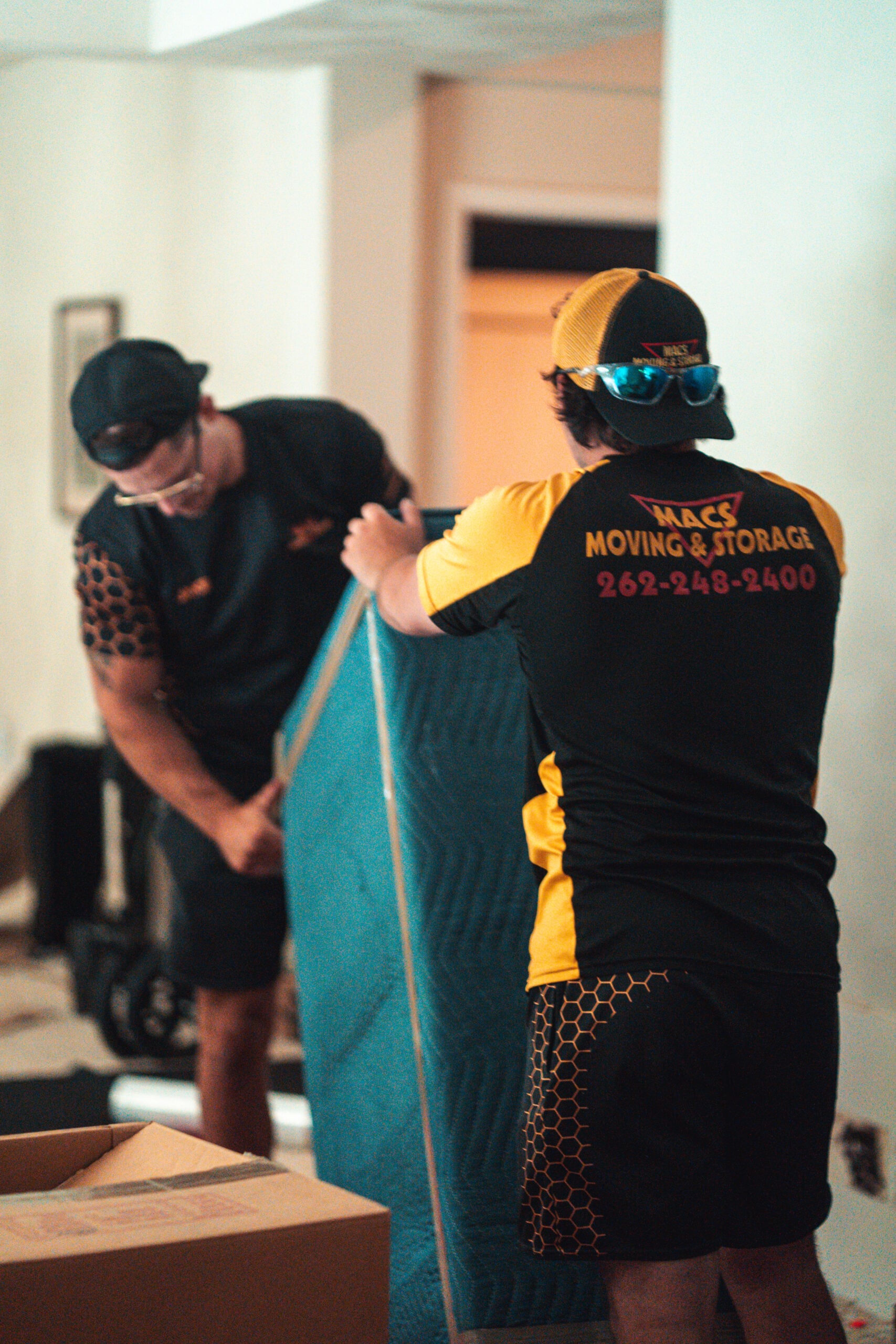 macs long distance movers loading furniture onto truck